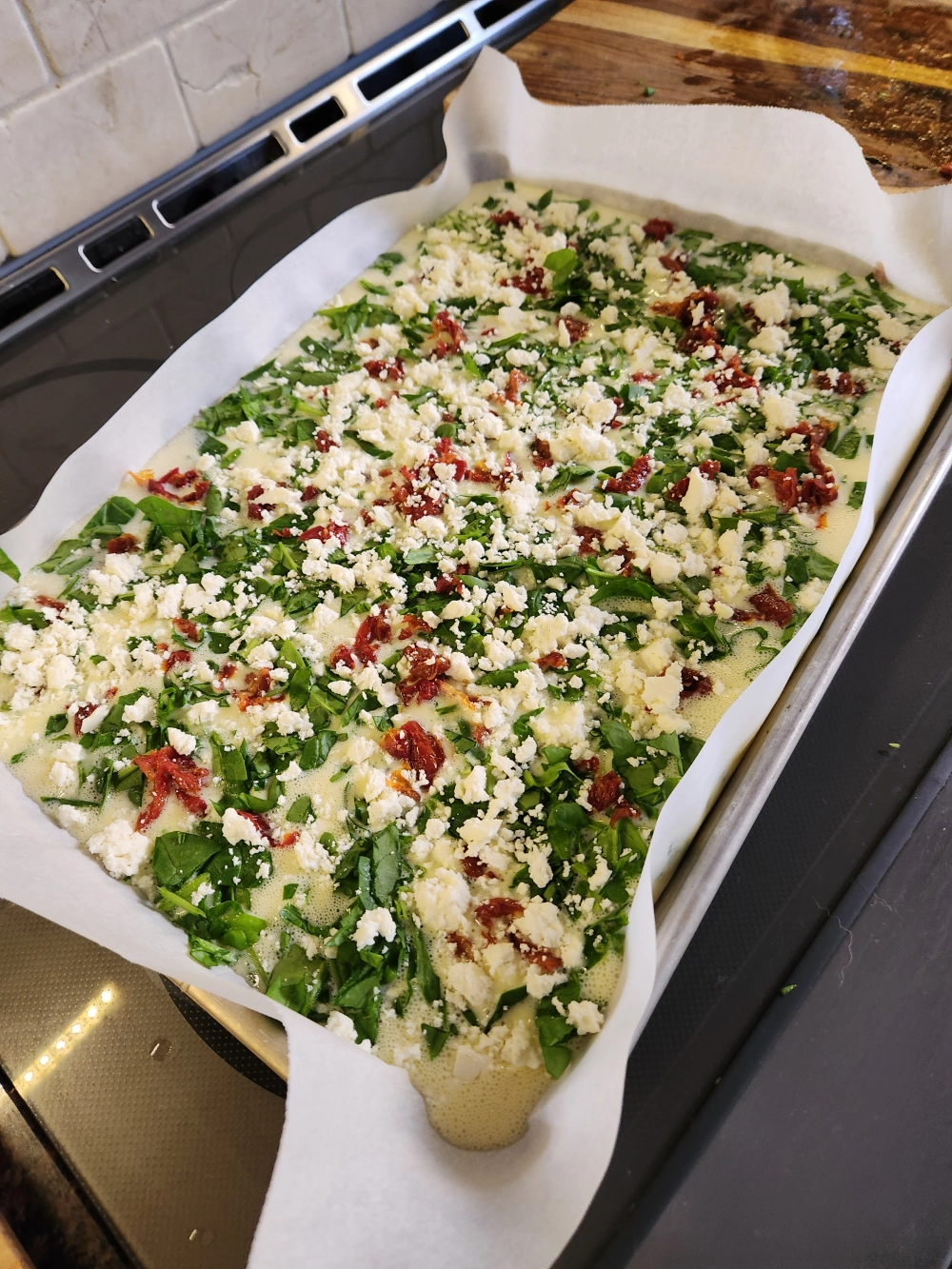 Egg Mixture in Sheet pan with parchment paper